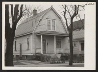 [recto] This is the home which the Yamada family rent in Peoria. They have the entire house, which is located in one of the residential districts in Peoria, Illinois. ;  Photographer: Mace, Charles E. ;  Peoria, Illinois.
