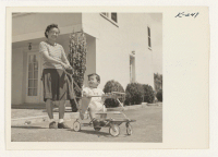 [recto] Mrs. Ray Ikeda and son, Lynolden, age 13 months, formerly of Topaz and Chicago, at home at 152 Eldorado Street, San Mateo. Mr. Ikeda works as a gardener. ;  Photographer: Iwasaki, Hikaru ;  San Mateo, California.