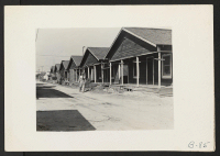 [recto] San Pedro, Calif.--View of homes from which residents of Japanese ancestry were evacuated on Terminal Island in Los Angeles harbor. Evacuees later were transferred for the duration to War Relocation Authority centers. ;  Photographer: Albers, Clem ;