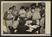 [recto] Manzanar, Calif.--Vaccination is required of evacuees at War Relocation Authority centers to guard against typhoid and other diseases. ;  Photographer: Albers, Clem ;  Manzanar, California.