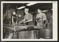 [recto] Jiro Habara (center) and Jack Sakamoto (right) work with Caucasian employees at a chrome plating plant in Cleveland. Both Japanese-Americans ...