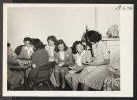[recto] While refreshments are served at a social in the Philadelphia, Pennsylvania, Hostel, Mrs. Arnold Nakajima, of Princeton, N.J., and Miss ...
