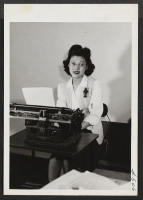 [recto] Natsumi Yamashita, formerly of Long Beach, California, is shown working as a typist for a large wholesale stationery concern in ...