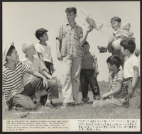 [recto] Mr. Nakada's children are shown playing with their Caucasian neighbor, Roger Abbot. Mr. Nakada, who owns a 10-acre ranch at ...