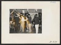 [recto] After the Labor Day queen coronation ceremony, a dance was held to celebrate the event. Square dances as well as jitterbug was enjoyed by all participants. ;  Photographer: Stewart, Francis ;  Newell, California.