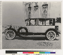Doble five passenger sedan with driver and passenger, side view