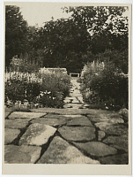 [view of stone bench and path]