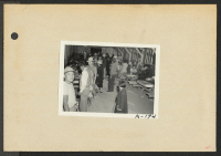 [recto] Poston, Ariz.--Site No. 1. Evacuees of Japanese ancestry signing up for the WRA Work Corps. ;  Photographer: Clark, Fred ;  Poston, Arizona.