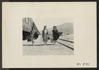 [recto] Lone Pine, Calif.--Arriving by train at Lone Pine from Elk Grove, California. Newcomers are transported by bus from Lone Pine to Manzanar, a War Relocation Authority center where evacuees of Japanese ancestry will spend the duration. ;  Photographer: St
