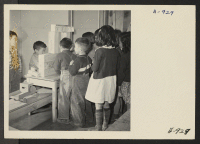 [recto] First grade students play post office in this class taught by Miss Martha Job. This set was constructed by the students themselves. ;  Photographer: Stewart, Francis ;  Manzanar, California.
