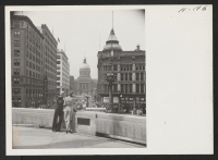 [recto] Looking down Market Street from the War Monument is the Capitol Building in downtown Indianapolis. ;  Photographer: Mace, Charles E. ;  Indianapolis, Indiana.