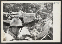 [recto] The Japanese-Americans who compose the 442nd combat team in training at Camp Shelby are keenly interested in daily news from ...