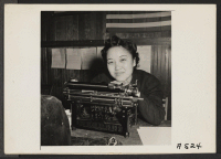 [recto] Stenographer for Japanese American Citizens League of Mr. Eden township. Helps the farmers of the vicinity to close out their affairs before evacuation. ;  Photographer: Lange, Dorothea ;  Centerville, California.