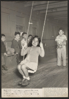 [recto] On a sundeck on the SS Shawnee, a group of small children have found entertainment while awaiting sailing orders in Los Angeles Harbor. The Shawnee was detailed to return 1100 persons of Japanese ancestry to their former homes in Hawaii. ;  Photographer