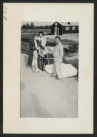 [recto] Receiving tags and check stubs for checkable baggages bound for Tule Lake. ;  Photographer: Lynn, Charles R. ;  Dermott, Arkansas.