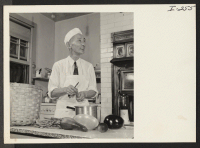 [recto] Mr. Kichii Saito (Granada) busy in the kitchen of the Greenough estate in Belmont, Massachusetts. ;  Photographer: Iwasaki, Hikaru ;  Belmont, Massachusetts.