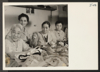 [recto] This picture shows Mrs. Tsuru Toguchi (right), age 42, formerly of San Francisco, California, and Topaz, Mrs. Sue Ogawa (center), ...