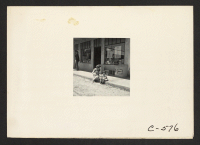 [recto] Florin, Calif.--In front of grocery store owned by resident of Japanese descent, two days before evacuation. ;  Photographer: Lange, Dorothea ;  Florin, California.