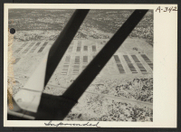 [recto] Aerial view of Colorado River Relocation Center for persons of Japanese ancestry evacuated from the West Coast. ;  Photographer: Clark, Fred ;  Poston, Arizona.
