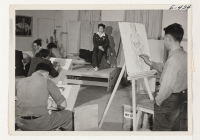 [recto] An adult art class under the direction of Tokio Ueyama, working in pencil sketch charcoals and oils. Adult art classes are extremely popular at the Amache Center. ;  Photographer: Parker, Tom ;  Amache, Colorado.