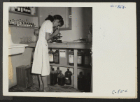 [recto] Manzanar, Calif.--Mary Uyesato, trained laboratory assistant at work in the medical center at this War Relocation Authority center for evacuees of Japanese ancestry. Former residence: Seaside Hospital, Long Beach, Calif. ;  Photographer: Lange, Dorothea
