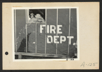 [recto] Poston, Ariz.-- Site No. 1. Evacuee firemen getting drinks at this War Relocation Authority center. Frank Shibata (right). ;  Photographer: Clark, Fred ;  Poston, Arizona.