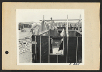 [recto] Poston, Ariz.--(Site # 3)--Barracks under construction at this War Relocation Authority center where evacuees of Japanese ancestry are spending the duration. ;  Photographer: Clark, Fred ;  Poston, Arizona.