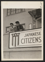 [recto] San Francisco, Calif.--High school boys, on balcony of Japanese American Citizens League at 2031 Bush Street, look down the sidewalk ...