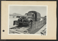 [recto] Poston, Ariz.-- Most of the hauling is being done by old CCC trucks at this War Relocation Authority center for evacuees of Japanese ancestry. ;  Photographer: Clark, Fred ;  Poston, Arizona.