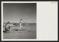 [recto] The 1944 league baseball season got under way at the Tule Lake Segregation Center on April 19. Project Director Ray R. Best tossed out the first ball. Nearly half of the 17,000 residents of the center were present for the opening game. ;  Newell, Califo