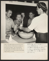 [recto] Soldiers and their partners pause for some refreshment between dances at the Washington USO for Nisei servicemen. From left to ...
