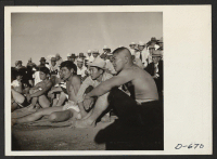 [recto] The wrestling tournament held at this center on Thanksgiving day was witnessed by a large crowd of residents. ;  Photographer: Stewart, Francis ;  Rivers, Arizona.