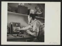 [recto] Radio Repair Shop. Chester Sakura, Radio Repairman. Former occupation: radio repairman. Former residence: Eatonville, Washington. ;  Photographer: Stewart, Francis ;  Hunt, Idaho.