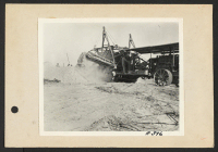 [recto] Poston, Ariz.--Sewer trench being dug by ditch digger at this War Relocation Authority center for evacuees of Japanese ancestry. ;  Photographer: Clark, Fred ;  Poston, Arizona.