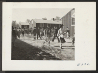 [recto] Changing classes at the temporary high school quarters. ;  Photographer: Parker, Tom ;  McGehee, Arkansas.