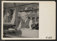 [recto] Mr. Tatsuno pictured in his San Francisco dry goods store prior to evacuation of residents of Japanese ancestry. He was in the goods business for 40 years in San Francisco. Evacuees will be housed in War Relocation Authority centers for the duration. ;