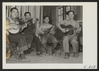 [recto] A self organized string quartet, or more accurately, a harikuri band, in a practice session at the Jerome Center. The ...