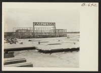 [recto] First truss erected in construction of new high school at Topaz. ;  Photographer: Bankson, Russell A. ;  Topaz, Utah.