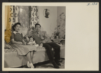 [recto] A typical Nisei family of Heart Mountain Relocation Center are Mr. and Mrs. Thomas Oki and their small daughter, Dinne. ...