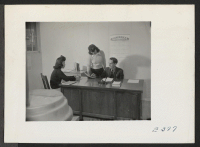 [recto] Mr. H. Zeigler, Elementary Principal, and his office staff, Miriam Minamo, Secretary (right), and Barbara Hamabe, File Clerk. ;  Photographer: Parker, Tom ;  McGehee, Arkansas.