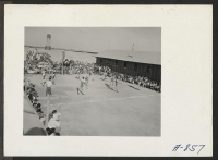 [recto] New Year's Fair. A basketball game was held as part of the athletic events to commemorate the New Year. ;  Photographer: Stewart, Francis ;  Poston, Arizona.