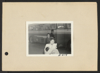 [recto] Poston, Ariz.--(Site #1) Young evacuee mother of Japanese ancestry arrives with her young baby at this War Relocation Authority center. ;  Photographer: Clark, Fred ;  Poston, Arizona.