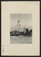 [recto] Manzanar, Calif.--Evacuee Boys Scouts took a leading part in the Memorial Day services held at this War Relocation Authority center for evacuees of Japanese ancestry. ;  Photographer: Stewart, Francis ;  Manzanar, California.