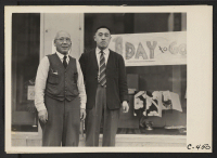 [recto] San Francisco, Calif. (Post and Bush Streets)--Dave Tatsuno and his father, merchants of Japanese ancestry in San Francisco prior to the evacuation. ;  Photographer: Lange, Dorothea ;  San Francisco, California.