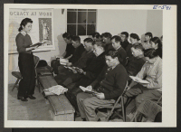 [recto] At the Heart Mountain Relocation Center, night school classes in advanced English are very popular. For the first time, many of the older people are now able to take advantage of the opportunity to read and write the language of their chosen country. ;