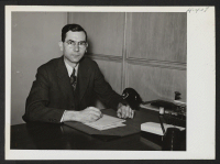 [recto] Milton C. Geuther is Relocation Officer for southern Illinois with headquarters at Peoria. ;  Photographer: Mace, Charles E. ;  Chicago, Illinois.