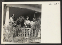 [recto] Mrs. Sue Ogawa and her two daughters, Mary and Lois, on the porch of their lovely home in the Hood ...