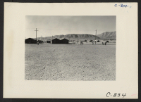 [recto] Manzanar, Calif.--Looking southwest across the wide firebreak at this War Relocation Authority center which houses 10,000 evacuees of Japanese ancestry. ...