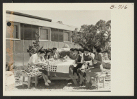 [recto] The sewing class teachers at Topaz making the Service Flag. ;  Photographer: Bankson, Russell A. ;  Topaz, Utah.