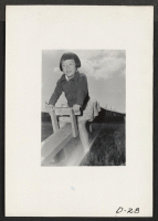 [recto] Tule Lake, Newell, Calif.-- Maye Ikemoto, 5, evacuee from Sacramento, California, takes a ride on the teeter-totter at the nursery school for children at this War Relocation Authority center for evacuees of Japanese descent. ;  Photographer: Stewart, Fr